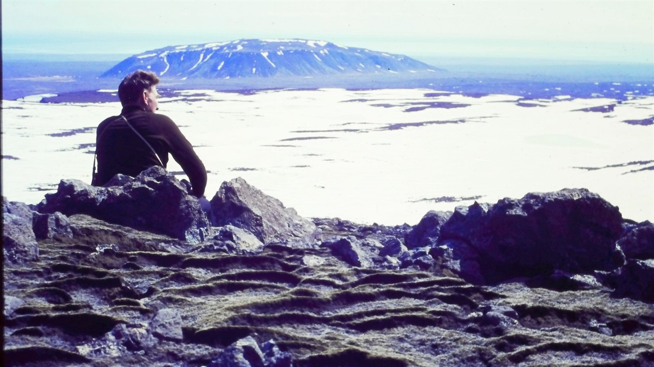 Man sitting on a mountain top